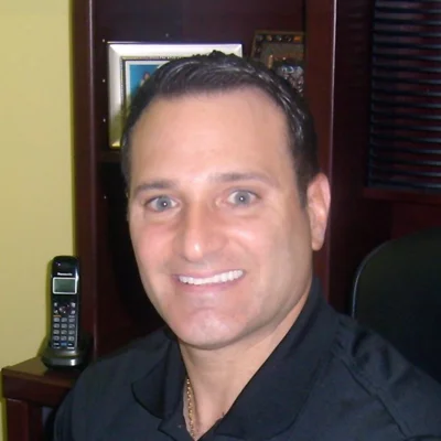 A headshot photo of Dr. Ernest Caruso